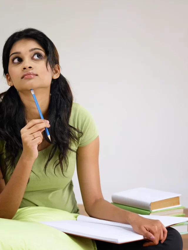 thoughtful-young-woman-studying-hardwood-floor-home